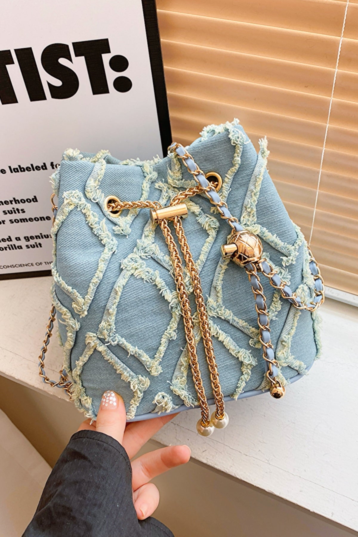 Chain Drawstring Raw Edge Denim Bucket BagBag size: Small
Material: Denim
Imported
Product Measurements (Measurements by inches) &amp; Size Conversion

Size
Actual Height
Actual Width
Actual Length


One SizChain Drawstring Raw Edge Denim Bucket BagChain Drawstring Raw Edge Denim Bucket Bag