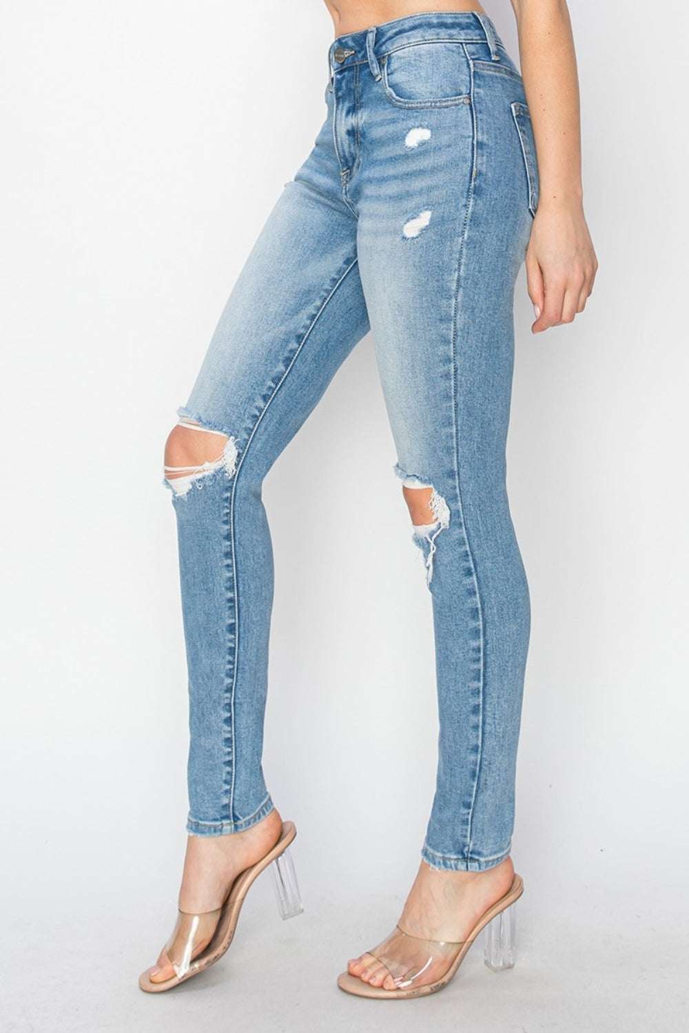 Risen Full Size High Rise Knee Distressed Skinny JeansThe High Rise Knee Distressed Skinny Jeans are a must-have for any fashion-forward wardrobe. Featuring a high-rise waist and skinny fit, these jeans offer a flatteriRisen Full Size High Rise Knee Distressed Skinny JeansRisen Full Size High Rise Knee Distressed Skinny Jeans