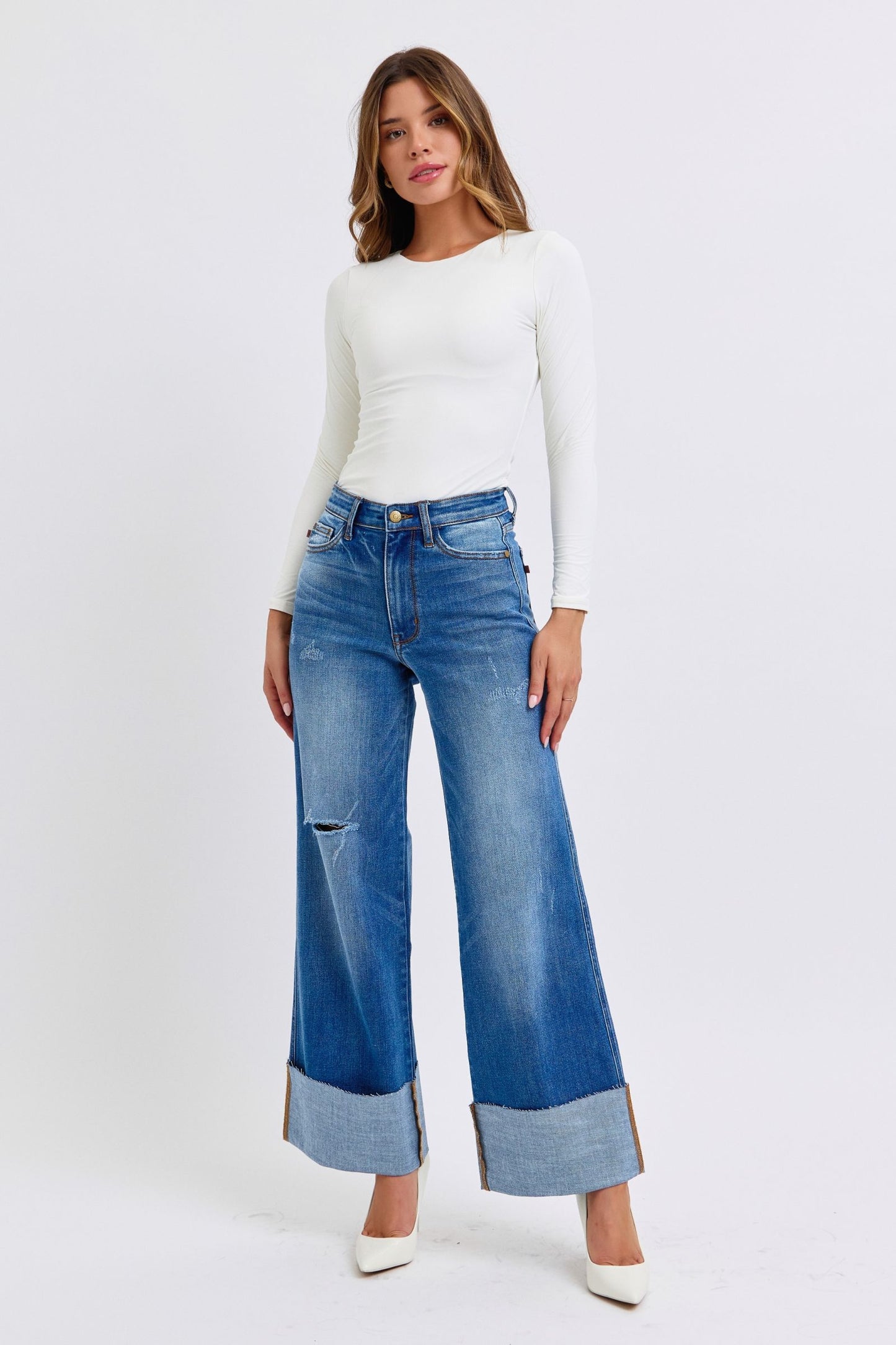 Judy Blue Full Size Distressed High Waist Wide Leg JeansThe Distressed High Waist Wide Leg Jeans are a stylish and on-trend choice for adding a touch of edge to your denim collection. The high waist design offers a flatteJudy Blue Full Size Distressed High Waist Wide Leg JeansJudy Blue Full Size Distressed High Waist Wide Leg Jeans