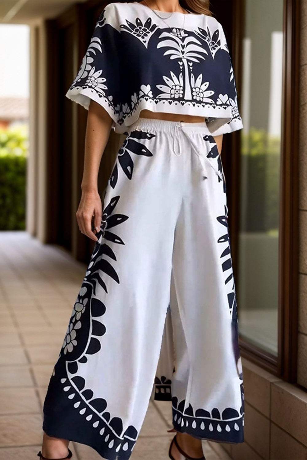 Printed Half Sleeve Top and Wide Leg Pants SetFeatures: Tied
Number of pieces: Two-piece
Stretch: No stretch
Material composition: 100% polyester
Care instructions: Machine wash cold. Tumble dry low.
Imported
PrPrinted Half Sleeve TopDressesPrinted Half Sleeve Top