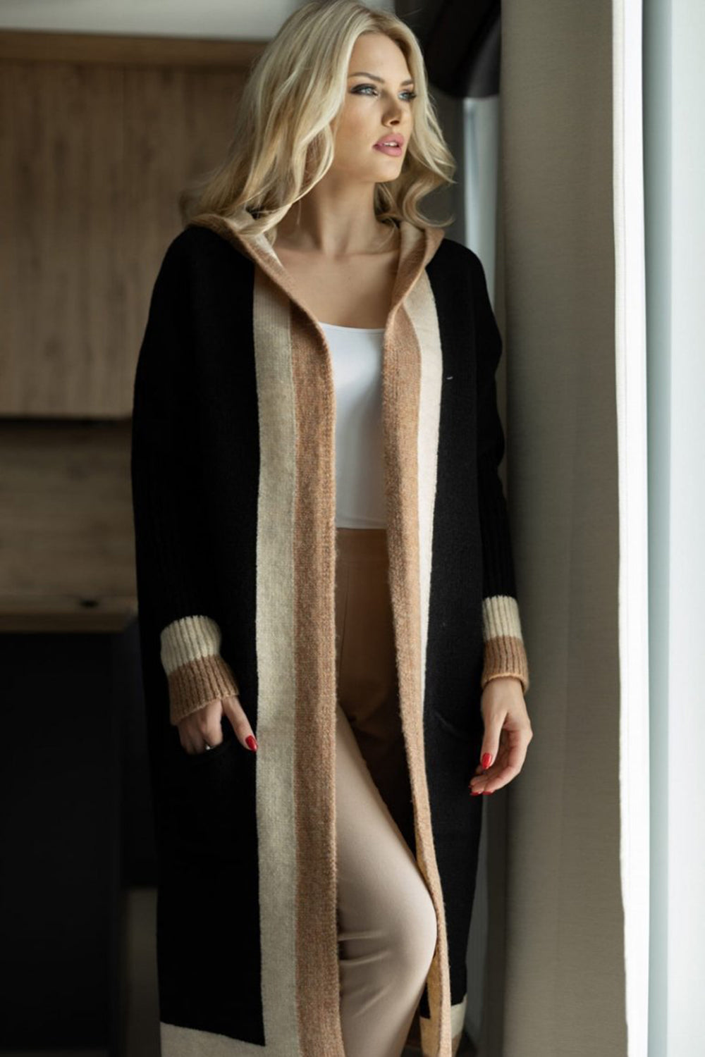 Pocketed Contrast Long Sleeve Hooded CardiganThis long sleeve hooded cardigan boasts luxurious contrast details and convenient pockets. Its sophisticated design adds elegance to any outfit, while the comfortablPocketed Contrast Long Sleeve Hooded CardiganPocketed Contrast Long Sleeve Hooded Cardigan