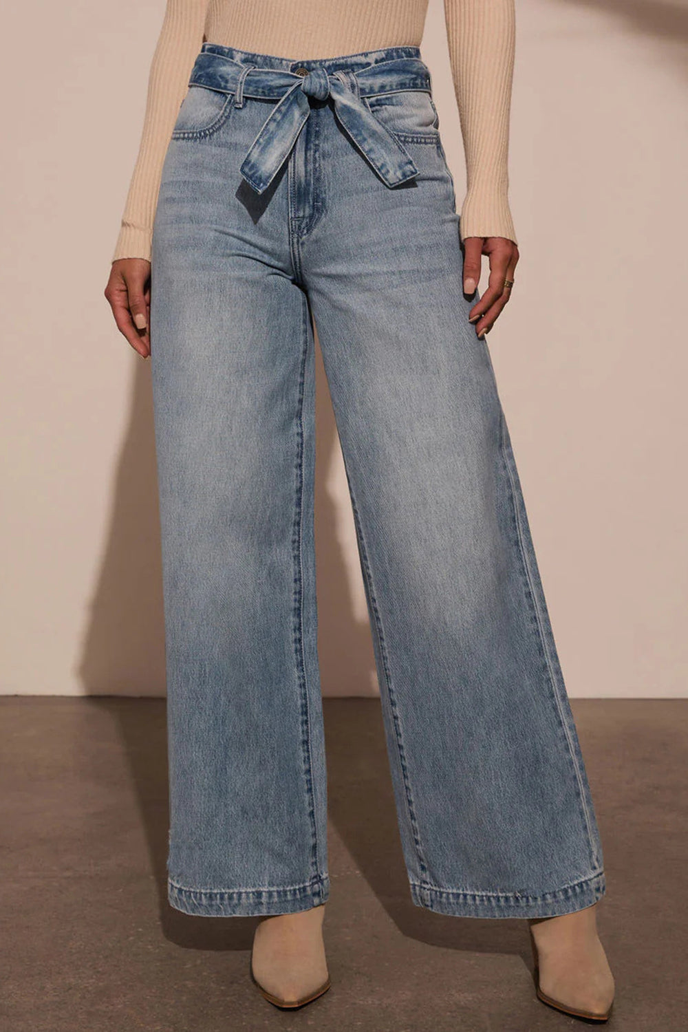 Tied Wide Leg Jeans with PocketsFeatures: Basic style
Stretch: No stretch
Material composition: 95% rayon, 5% polyester
Care instructions: Machine wash cold. Tumble dry low.
Imported
Product MeasurTied Wide Leg JeansTied Wide Leg Jeans