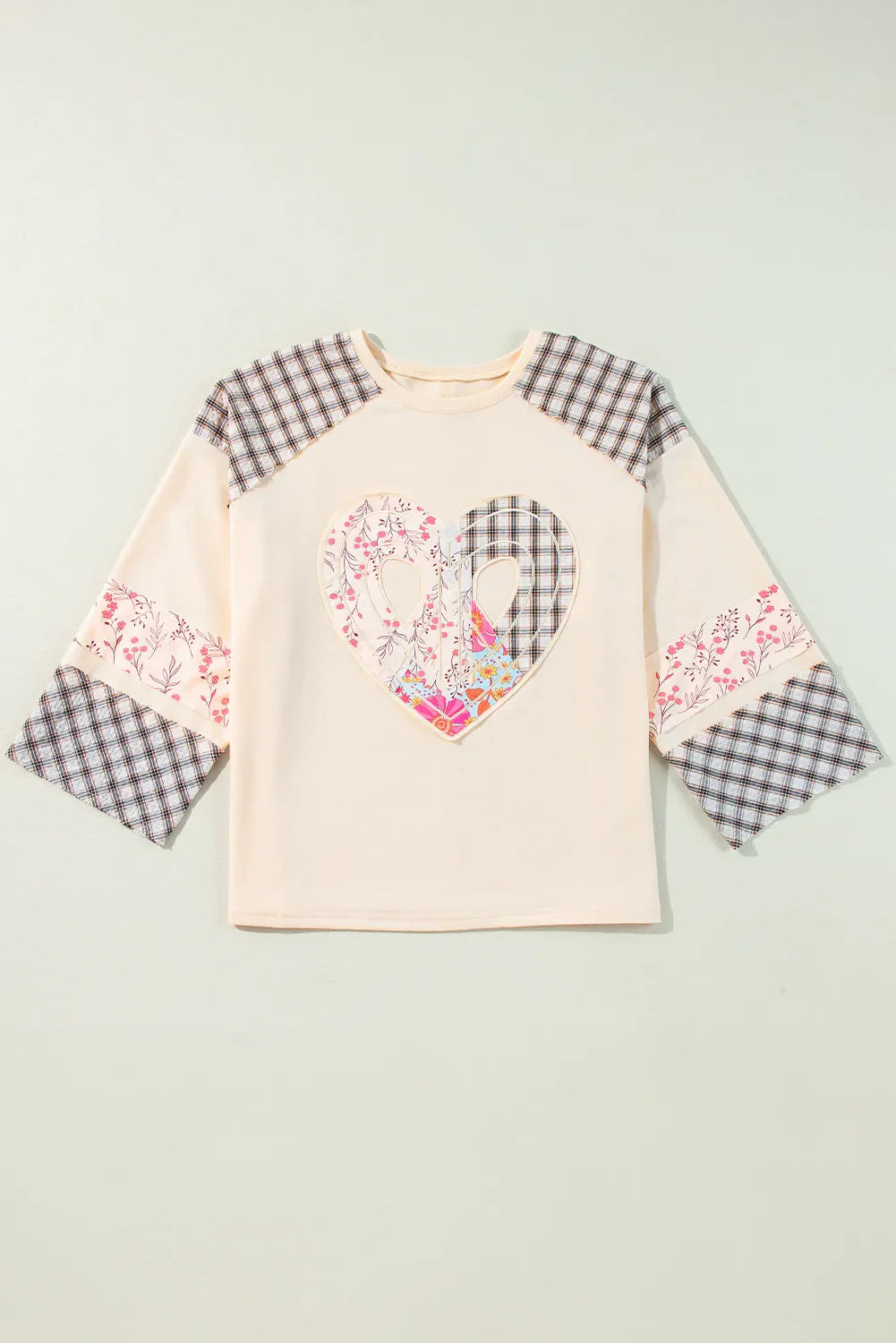 Heart Plaid Round Neck Long Sleeve BlouseFeatures: Basic style
Sheer: Opaque
Stretch: Slightly stretchy
Material composition: 85% polyester, 10% cotton, 5% elastane
Care instructions: Machine wash cold. TumHeart Plaid Round Neck Long Sleeve BlouseHeart Plaid Round Neck Long Sleeve Blouse