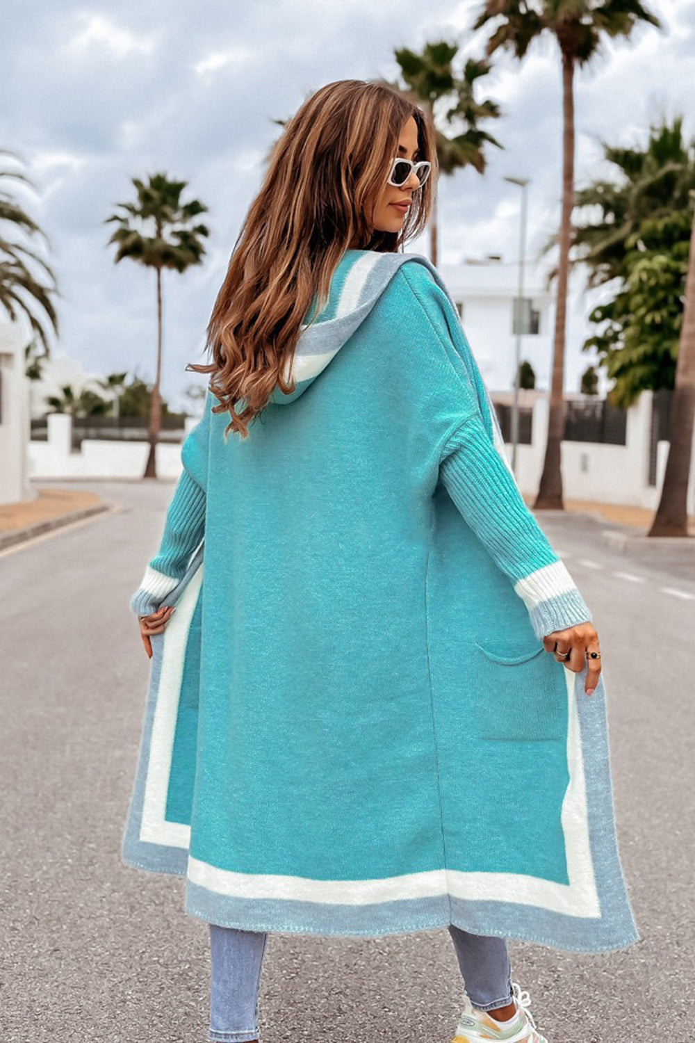 Pocketed Contrast Long Sleeve Hooded CardiganThis long sleeve hooded cardigan boasts luxurious contrast details and convenient pockets. Its sophisticated design adds elegance to any outfit, while the comfortablPocketed Contrast Long Sleeve Hooded CardiganPocketed Contrast Long Sleeve Hooded Cardigan