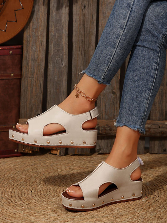 PU Leather Studded Wedge SandalsIncludes: Box not included
Heel height: Flats
Material: Rubber, PU
Imported
Product Measurements (Measurements by inches) &amp; Size Conversion

Size
Foot length


3PU Leather Studded Wedge SandalsPU Leather Studded Wedge Sandals