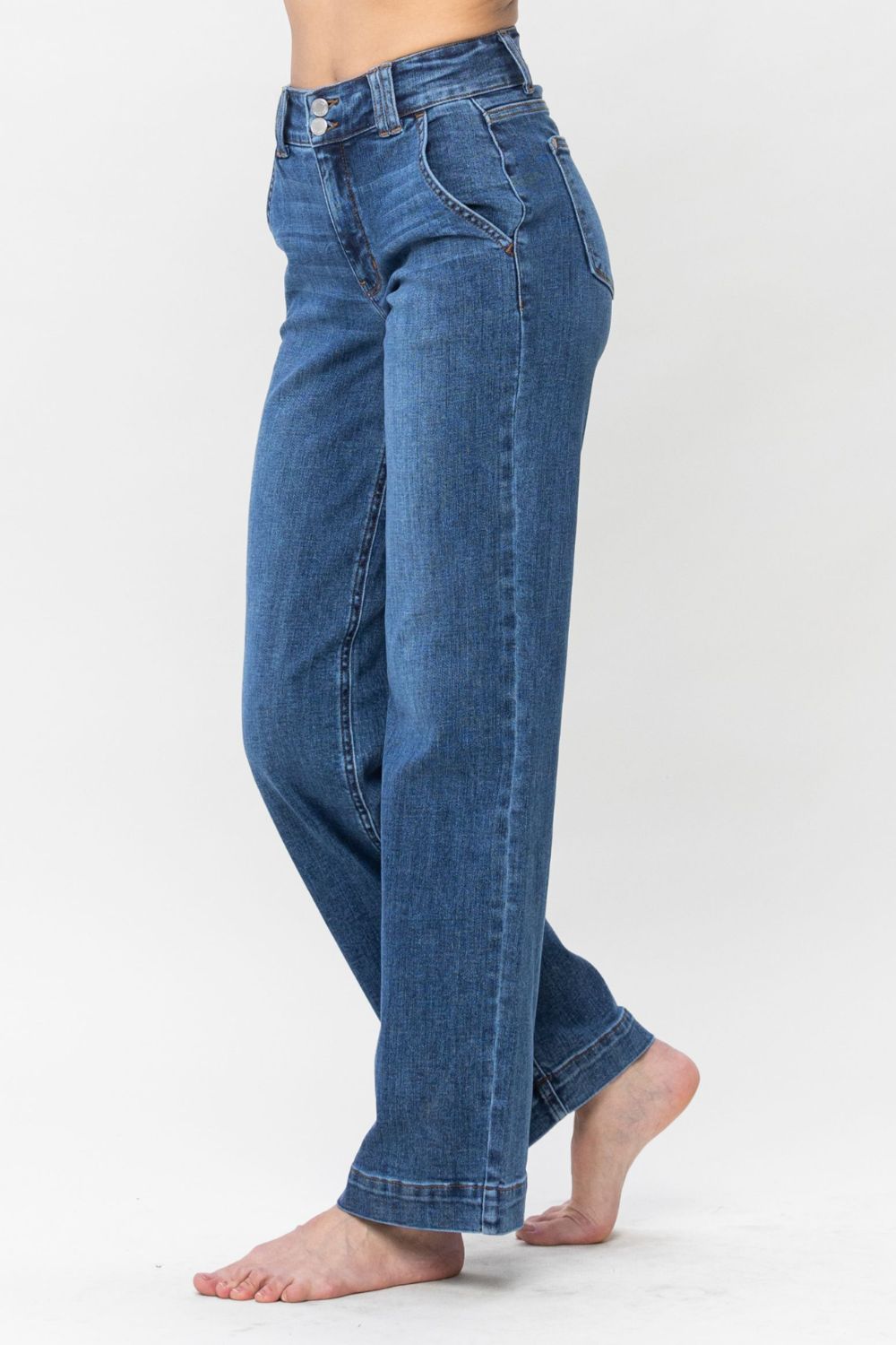 Judy Blue Full Size Double Button Wide Leg JeansHigh Rise Double button wide leg jeans are stylish wide leg jeans with a unique design and two buttons to add personality. Its loose pant leg cut, is comfortable andJudy Blue Full Size Double Button Wide Leg JeansJudy Blue Full Size Double Button Wide Leg Jeans