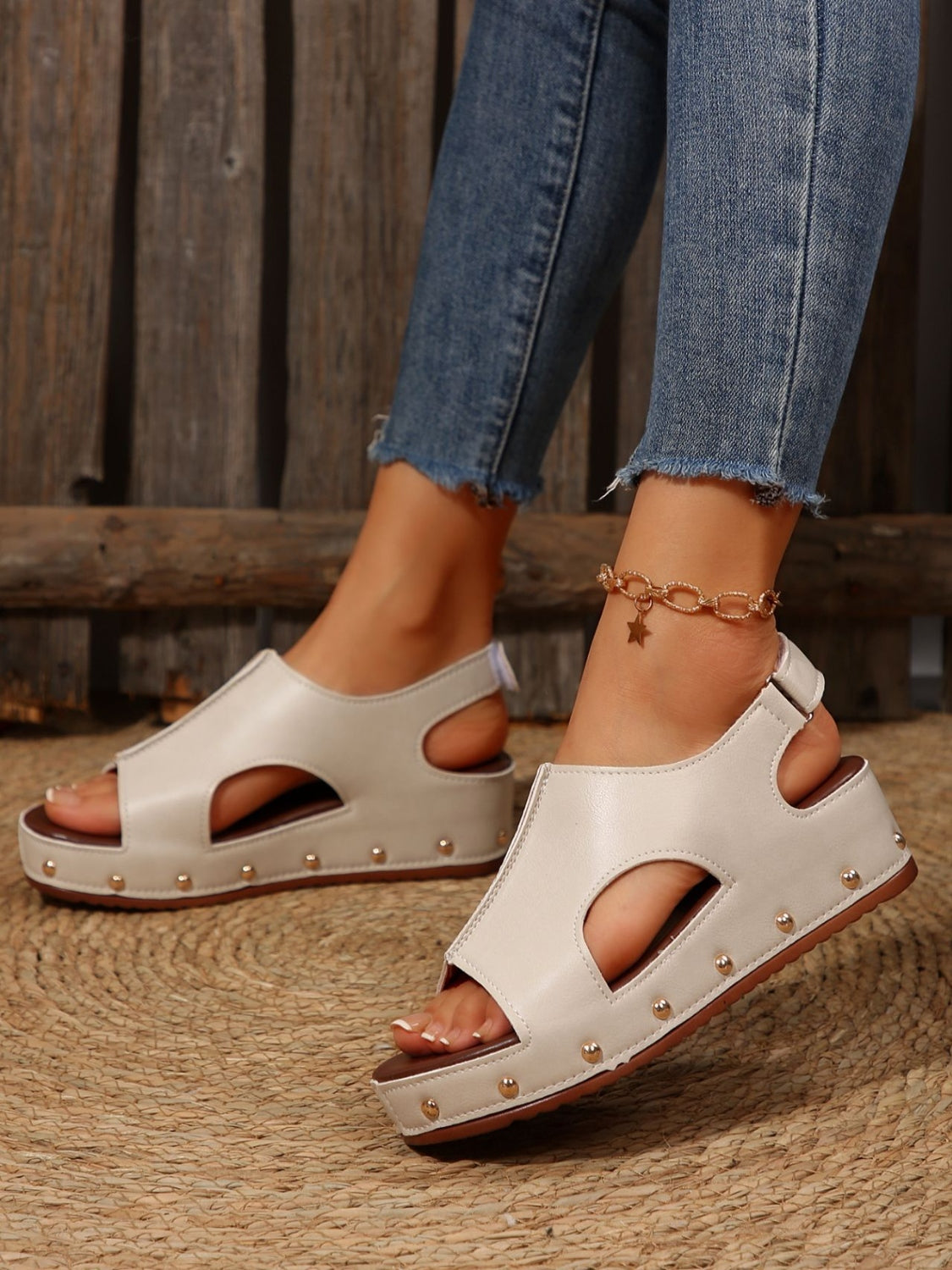 PU Leather Studded Wedge SandalsIncludes: Box not included
Heel height: Flats
Material: Rubber, PU
Imported
Product Measurements (Measurements by inches) &amp; Size Conversion

Size
Foot length


3PU Leather Studded Wedge SandalsPU Leather Studded Wedge Sandals