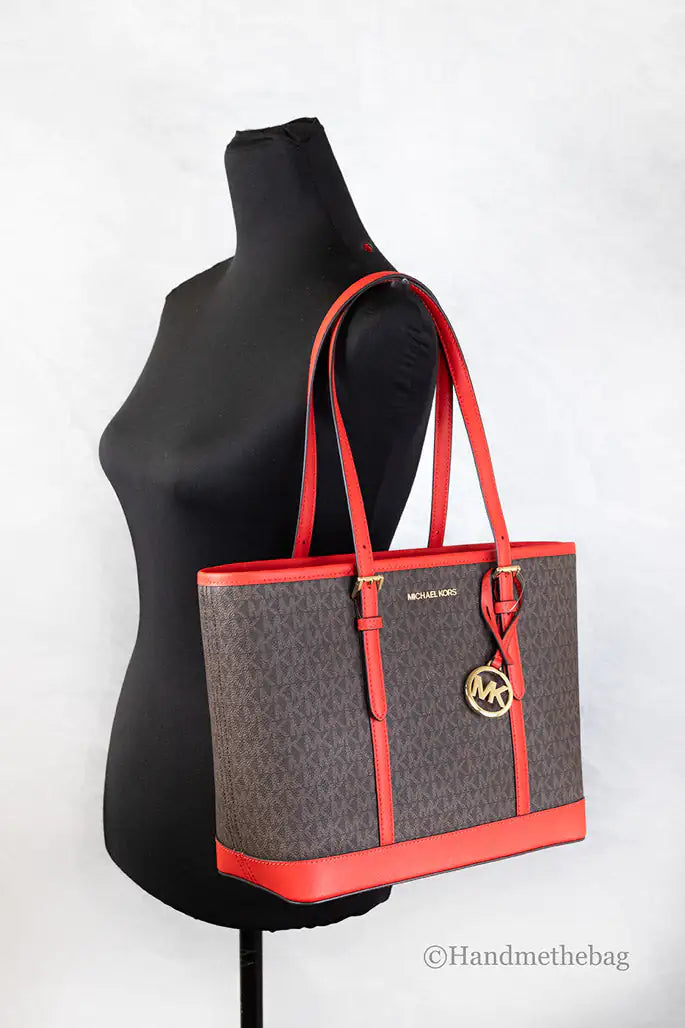 Michael Kors Jet Set Sangria Shoulder Tote PurseMichael Kors Jet Set Shoulder Tote Purse – SangriaBrighten your style with the Michael Kors Jet Set Shoulder Tote Purse in Sangria. This chic tote features a spaciouMichael Kors Jet Set Sangria Shoulder Tote PurseMichael Kors Jet Set Sangria Shoulder Tote Purse