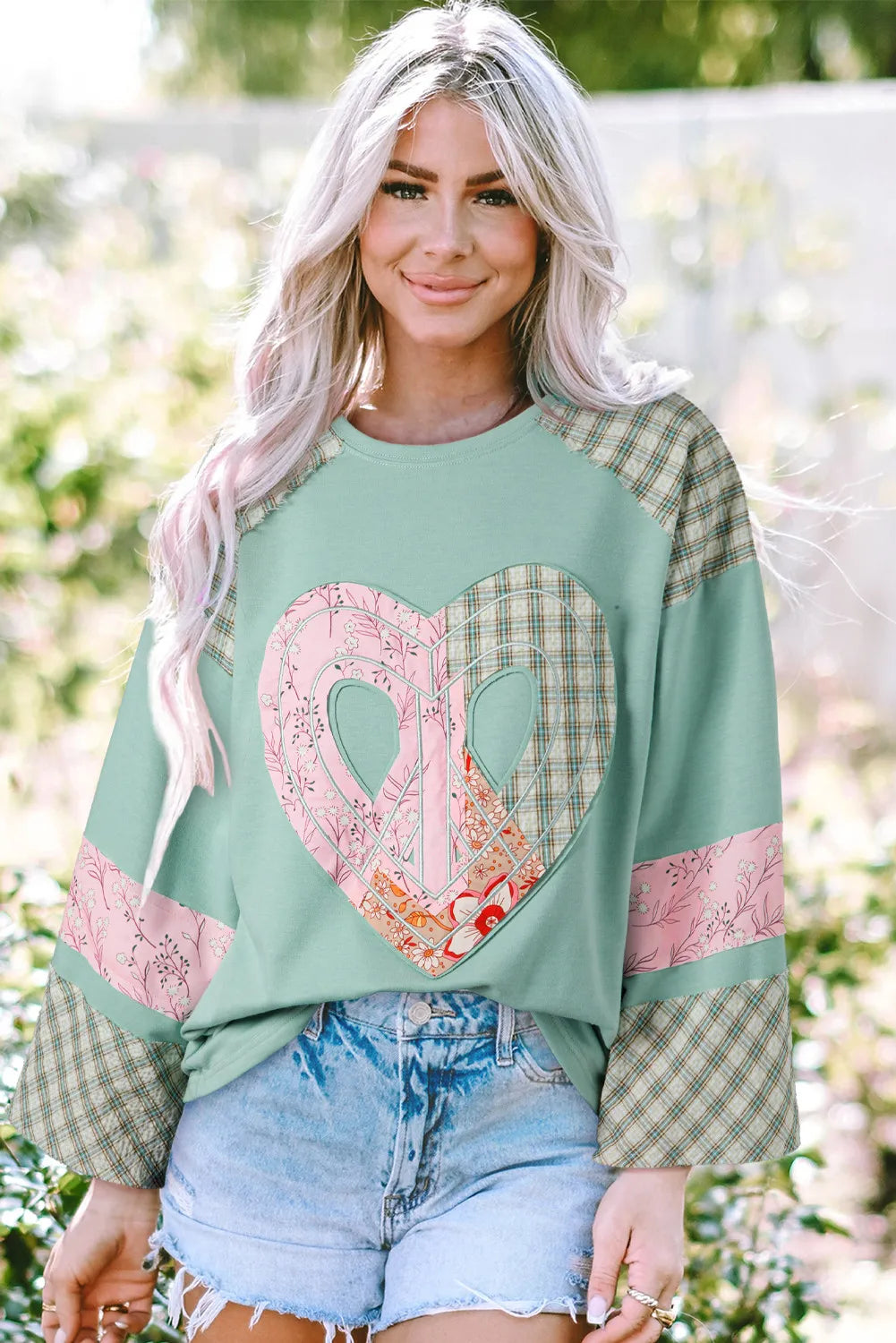 Heart Plaid Round Neck Long Sleeve BlouseFeatures: Basic style
Sheer: Opaque
Stretch: Slightly stretchy
Material composition: 85% polyester, 10% cotton, 5% elastane
Care instructions: Machine wash cold. TumHeart Plaid Round Neck Long Sleeve BlouseHeart Plaid Round Neck Long Sleeve Blouse