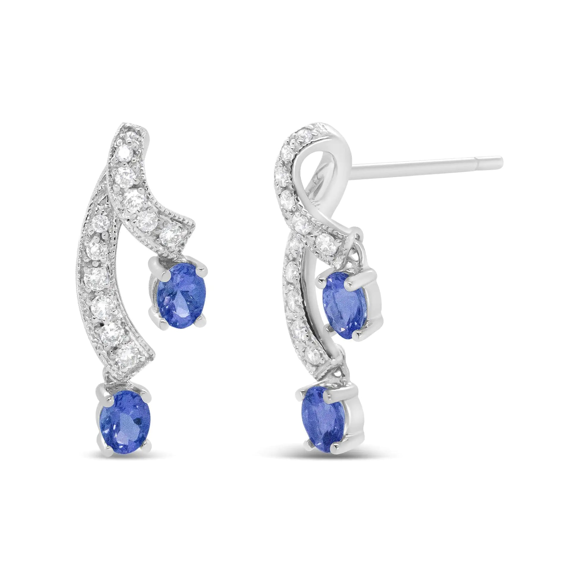 14K White Gold Ribbon Twist Tanzanite and Diamond Drop Earrings – ElegExperience the perfect blend of elegance and color with these 14K White Gold Ribbon Twist Tanzanite and Diamond Drop Earrings. The exquisite tanzanite gemstones are 14K White Gold Ribbon Twist TanzaniteEarrings14K White Gold Ribbon Twist Tanzanite