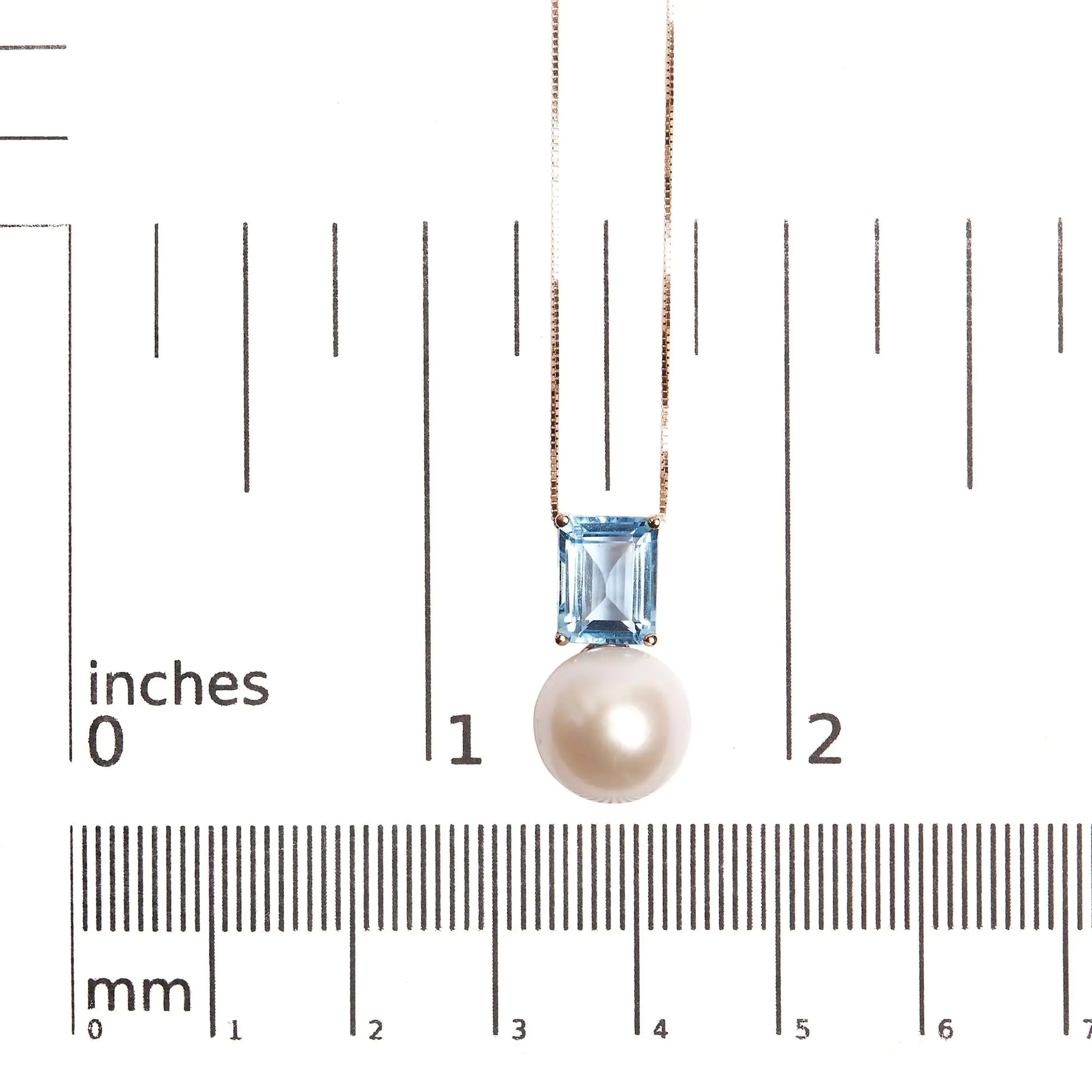 14K Rose Gold Pearl and Swiss Blue Topaz Pendant NecklaceThis exquisite 14K Rose Gold Pendant Necklace features a stunning combination of a lustrous pearl and Swiss blue topaz, totaling 3 1/3 carats. The elegant design is Swiss Blue Topaz Pendant NecklaceNecklacesSwiss Blue Topaz Pendant Necklace