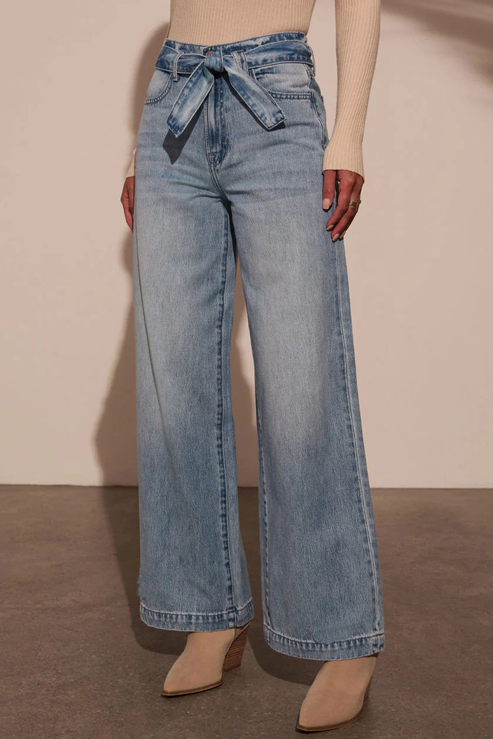 Tied Wide Leg Jeans with PocketsFeatures: Basic style
Stretch: No stretch
Material composition: 95% rayon, 5% polyester
Care instructions: Machine wash cold. Tumble dry low.
Imported
Product MeasurTied Wide Leg JeansTied Wide Leg Jeans