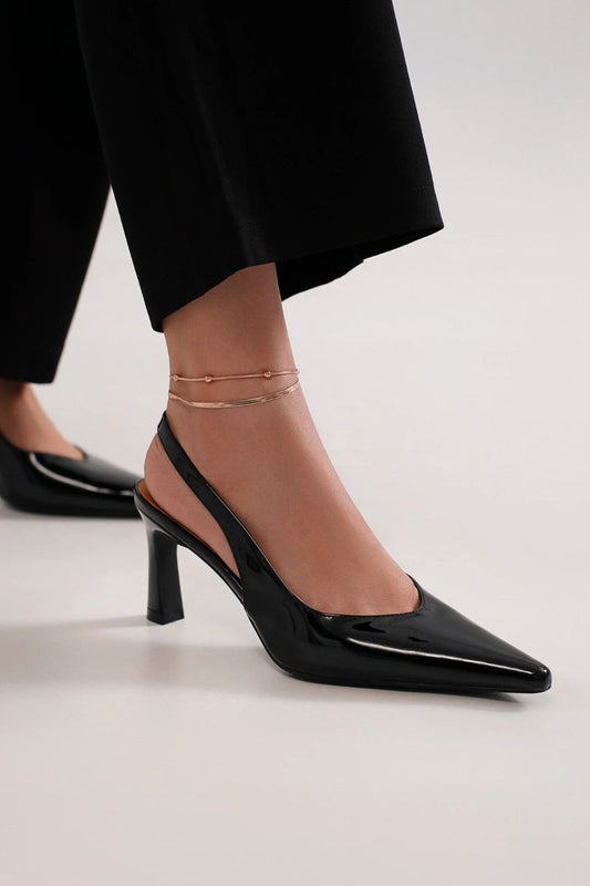 Faux Leather Point Toe Slingback PumpsFaux Leather Point Toe Slingback Pumps are a sophisticated and stylish footwear option. These pumps feature a faux leather material that exudes a sleek and polished Faux Leather Point Toe Slingback PumpsShoesFaux Leather Point Toe Slingback Pumps