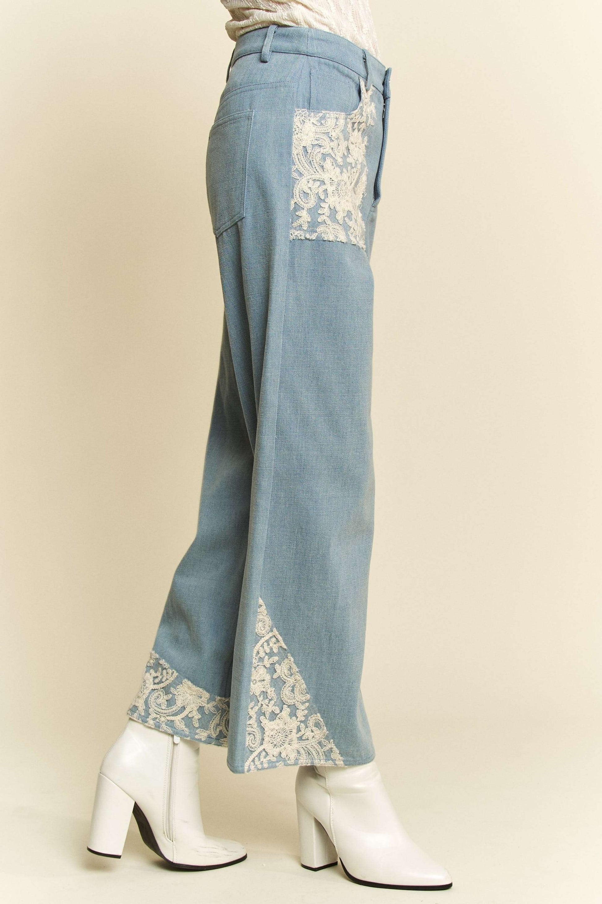 Davi & Dani Lace Applique Wide Leg JeansThese Lace Applique Wide Leg Jeans are the perfect statement piece for any fashion-forward individual. The delicate lace detailing adds a touch of femininity to thesDavi & Dani Lace Applique Wide Leg JeansDavi & Dani Lace Applique Wide Leg Jeans