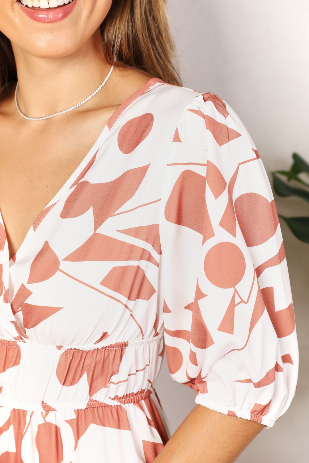 Printed Surplice Balloon Sleeve DressThis printed dress features a surplice neckline for an elegant and flattering look. The balloon sleeves add a touch of whimsy and playfulness to the dress. With its Printed Surplice Balloon Sleeve DressDressesPrinted Surplice Balloon Sleeve Dress