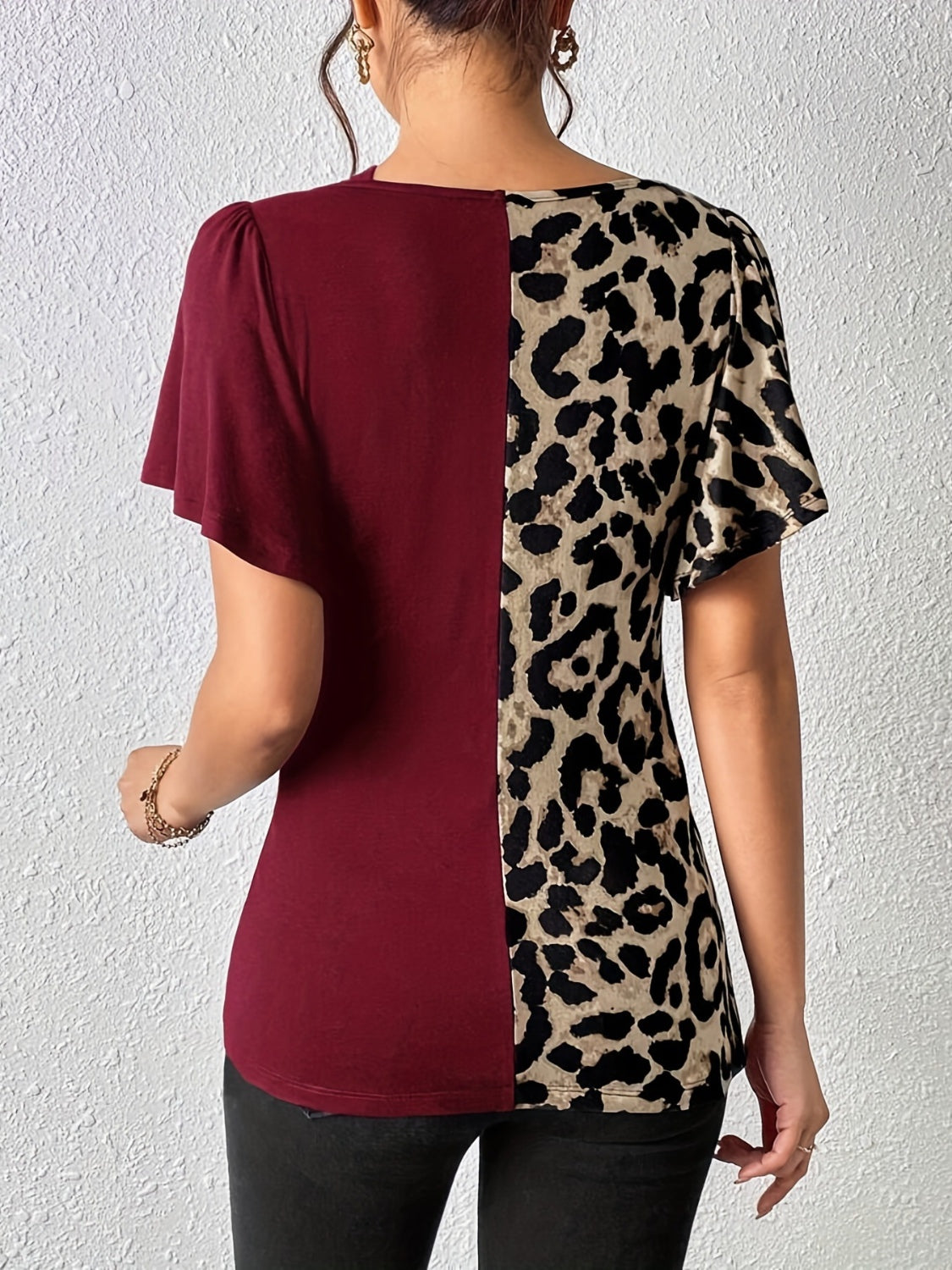 Ruched Leopard Flutter Sleeve T-ShirtIndulge in luxury with our Ruched Leopard Flutter Sleeve T-Shirt. The ruched detail and flutter sleeves add a touch of elegance to this already fierce leopard print Ruched Leopard Flutter SleeveRuched Leopard Flutter Sleeve