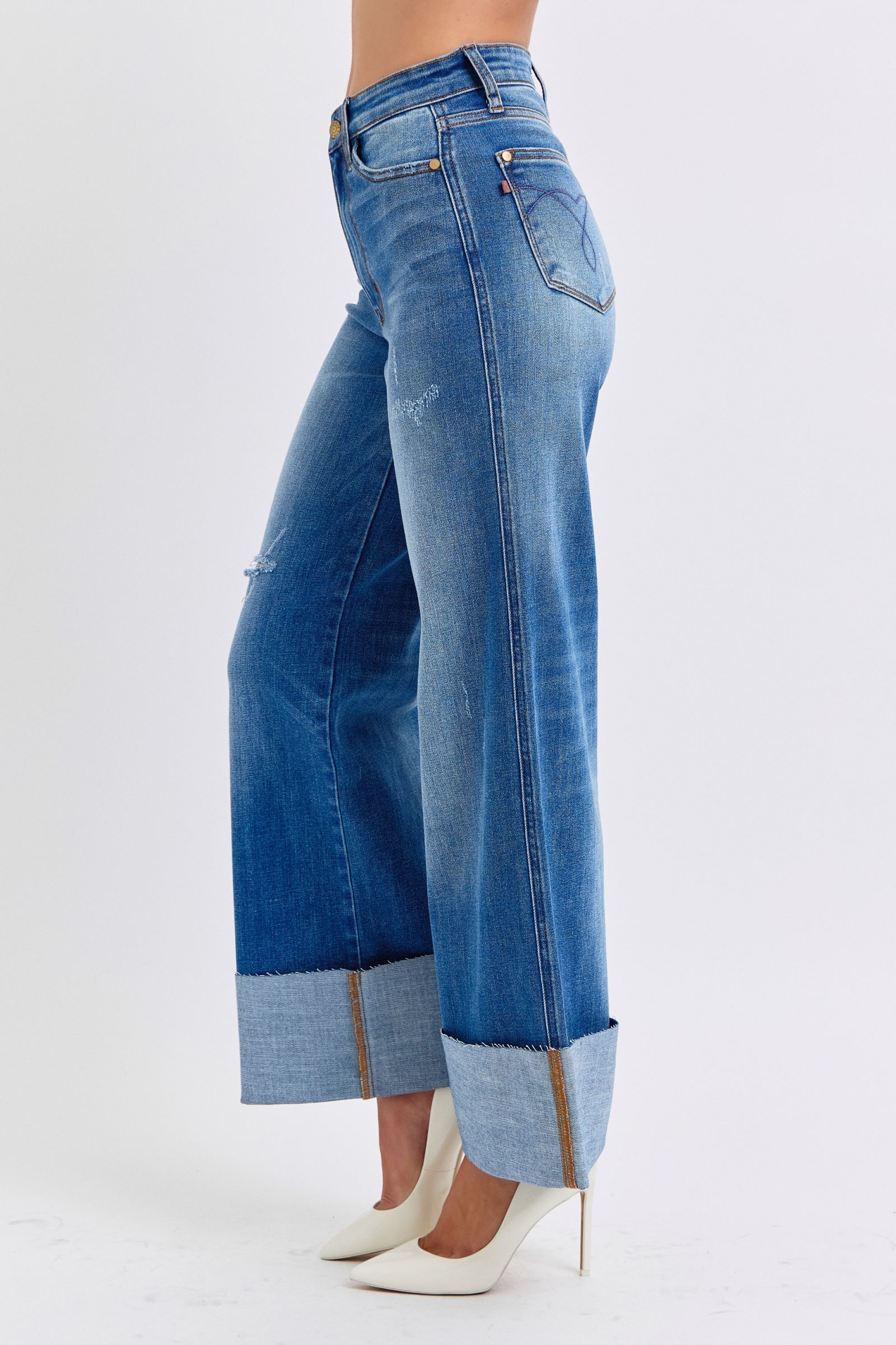 Judy Blue Full Size Distressed High Waist Wide Leg JeansThe Distressed High Waist Wide Leg Jeans are a stylish and on-trend choice for adding a touch of edge to your denim collection. The high waist design offers a flatteJudy Blue Full Size Distressed High Waist Wide Leg JeansJudy Blue Full Size Distressed High Waist Wide Leg Jeans