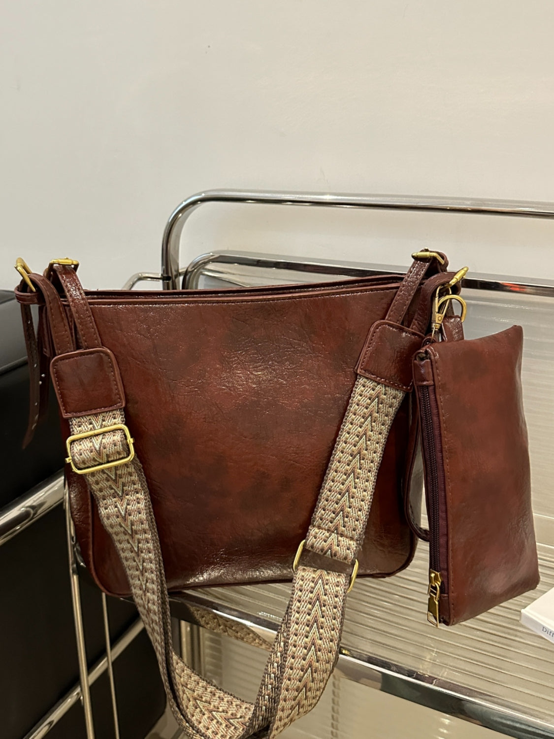 PU Leather Adjustable Strap Crossbody Bag with PouchBag size: Medium
Material: PU leather
Imported
Product Measurements (Measurements by inches) &amp; Size Conversion

Size
Actual Length
Actual Width
Actual Height


OPU Leather Adjustable Strap Crossbody BagPU Leather Adjustable Strap Crossbody Bag