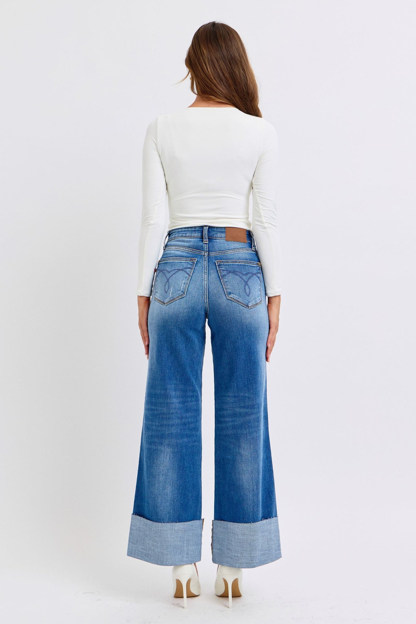 Judy Blue Full Size Distressed High Waist Wide Leg JeansThe Distressed High Waist Wide Leg Jeans are a stylish and on-trend choice for adding a touch of edge to your denim collection. The high waist design offers a flatteJudy Blue Full Size Distressed High Waist Wide Leg JeansJudy Blue Full Size Distressed High Waist Wide Leg Jeans