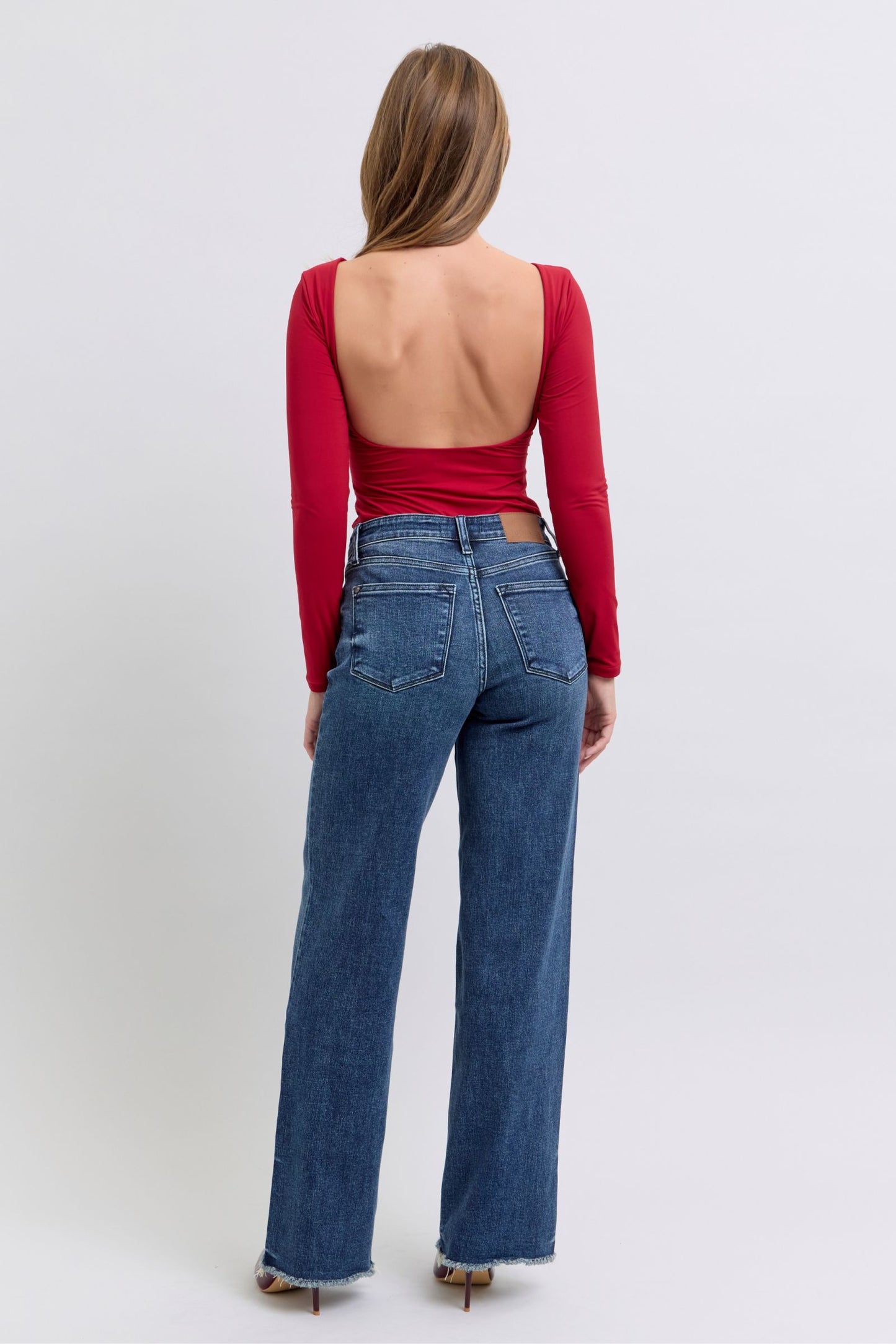 Judy Blue Full Size Raw Hem Mid Rise JeansRaw hem mid-rise jeans are a fashionable and on-trend denim style. The "raw hem" refers to the unfinished edge at the bottom of the jeans, creating a frayed or raw lJudy Blue Full Size Raw Hem Mid Rise JeansJudy Blue Full Size Raw Hem Mid Rise Jeans