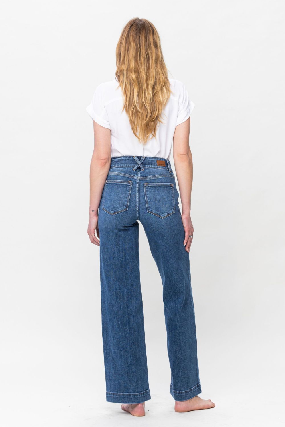 Judy Blue Full Size Double Button Wide Leg JeansHigh Rise Double button wide leg jeans are stylish wide leg jeans with a unique design and two buttons to add personality. Its loose pant leg cut, is comfortable andJudy Blue Full Size Double Button Wide Leg JeansJudy Blue Full Size Double Button Wide Leg Jeans