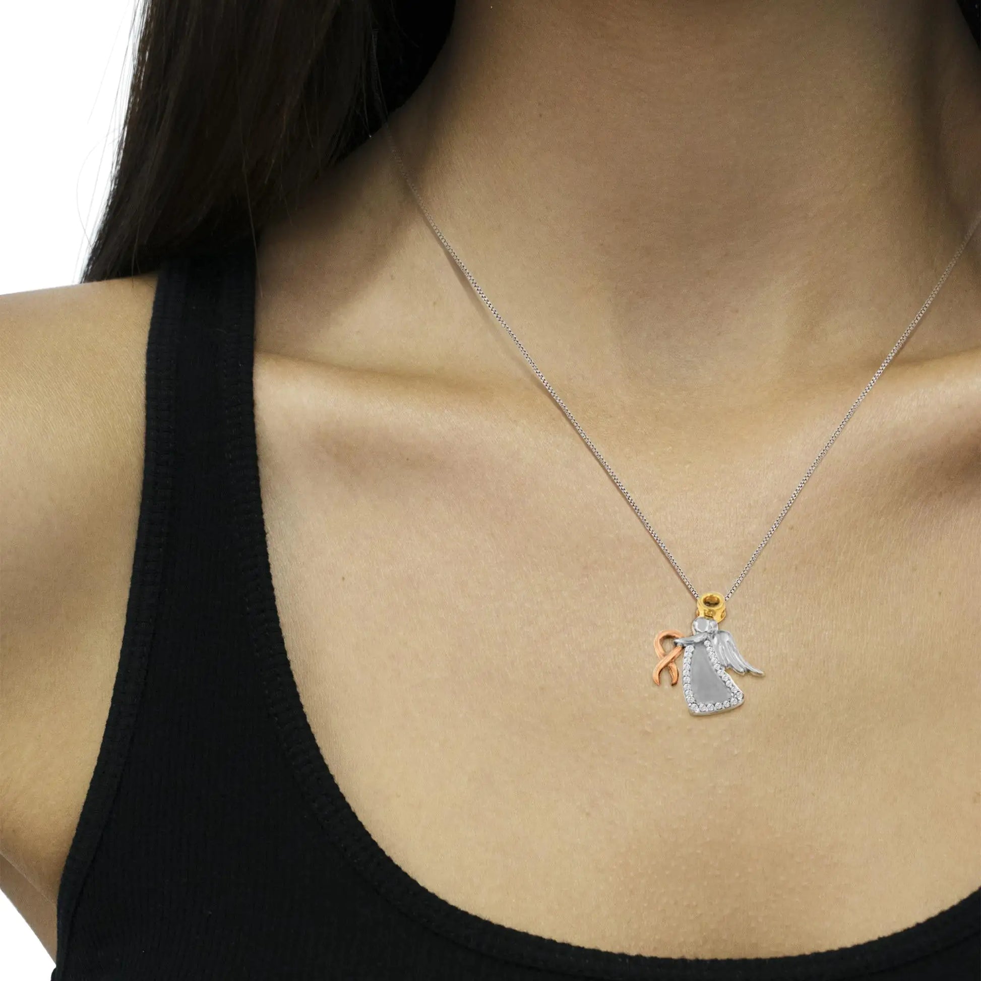 10K Tri-Color Gold Diamond-Accented Angel Awareness Ribbon Pendant NecThis charming pendant showcases that angels do exist. Gently clasping 10 karats rose gold ribbon in her hands, the beautiful angel is depicted in the two tone gold a10K Tri-Color Gold Diamond-Accented Angel Awareness Ribbon Pendant Necklace Necklace10K Tri-Color Gold Diamond-Accented Angel Awareness Ribbon Pendant Necklace 