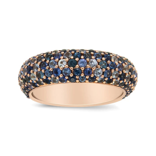 18K Rose Gold Multi Row Blue Sapphire Domed Top Band RingA glamorous piece reminiscent of the ocean, this rose gold band is embellished with stunning sapphires of different calibers of blue tones. The shaded blue gemstones18K Rose Gold Multi Row Blue Sapphire Domed Top Band Ring18K Rose Gold Multi Row Blue Sapphire Domed Top Band Ring