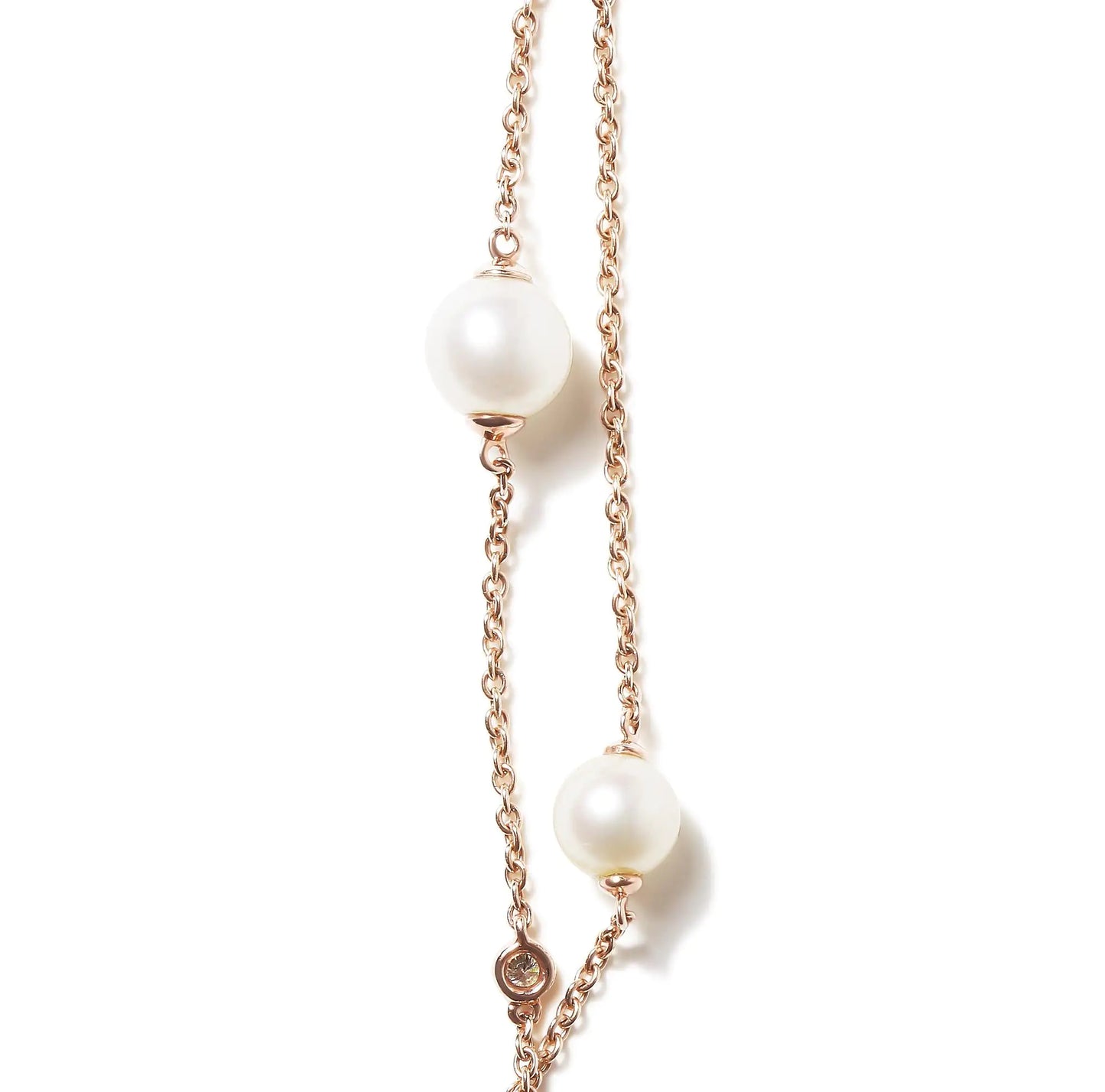 18K Rose Gold 1/2 Cttw Diamond and Freshwater Pearl Double Strand StatAdd a touch of elegance to your jewelry collection with this 18k rose gold double-strand station necklace. Featuring multi-sized Chinese freshwater cultured ivory pe18K Rose Gold 12 Cttw Diamond18K Rose Gold 12 Cttw Diamond