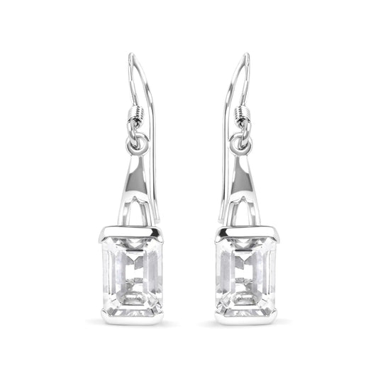 Sterling silver emerald cut white topaz solitaire dangle earrings with lever-back.