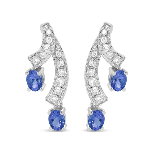 14K White Gold Ribbon Twist Tanzanite and Diamond Drop Earrings with elegant blue gemstones.