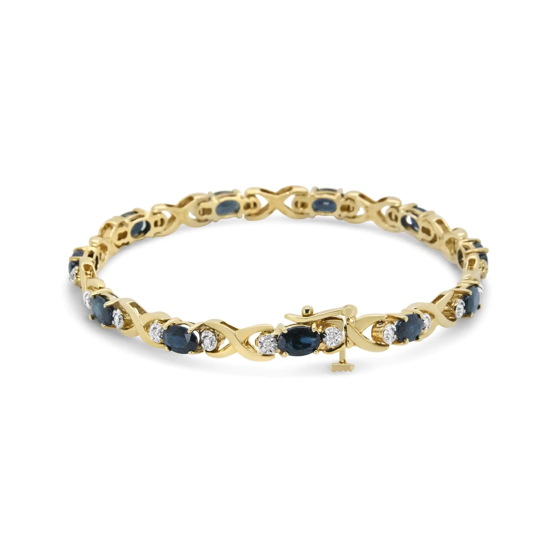 14K Yellow Gold 1 1/4 Cttw Round Diamond and 6x4mm Blue Sapphire "X" LMasterfully set in a unique motif and illuminated with the sparkle of round diamonds, this gemstones in link bracelet are remarkable! Stunning 6x4mm oval blue sapphi14K Yellow Gold 1 14 Cttw Round Diamond14K Yellow Gold 1 14 Cttw Round Diamond