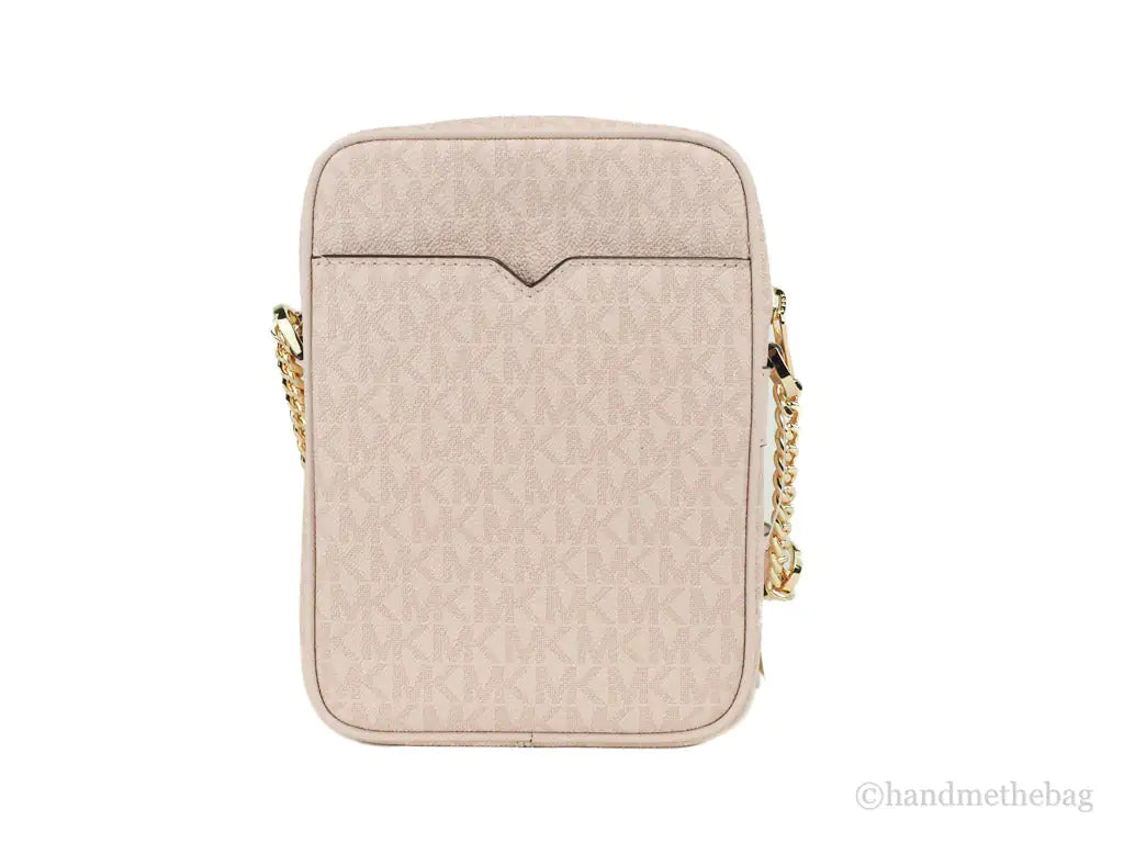 Michael Kors Jet Set Travel Medium Flight Crossbody Bag – Powder BlushTravel in style with the Michael Kors Jet Set Medium Flight Crossbody Bag in Powder Blush. Crafted from signature PVC, it features an inner slip pocket, 3 card slotsMichael Kors Jet Set Travel Medium Flight Crossbody Bag – Powder Blush PVCMichael Kors Jet Set Travel Medium Flight Crossbody Bag – Powder Blush PVC