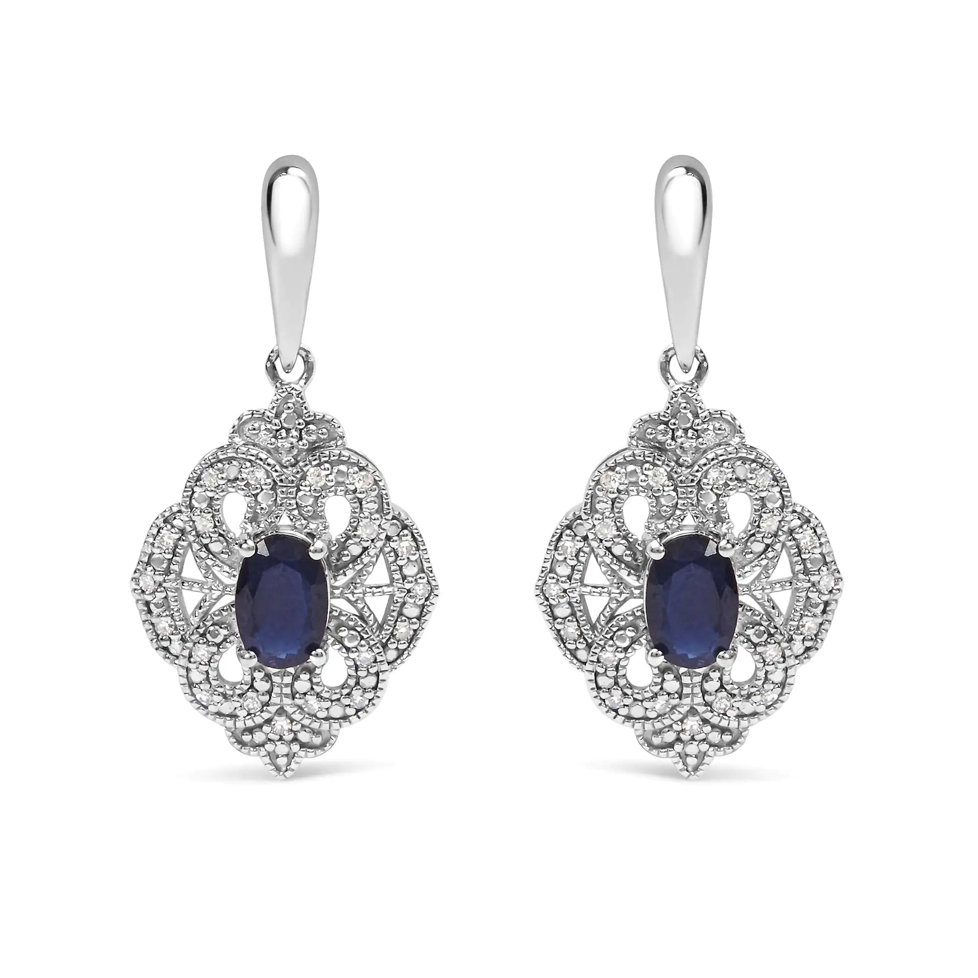 Sterling Silver Oval Blue Sapphire and White Diamond Accent Art Deco SEmbark on a journey of timeless elegance with these exquisite Art Deco-inspired shield dangle earrings. Crafted from the finest .925 sterling silver, they showcase tWhite Diamond Accent Art Deco Style Shield Dangle EarringWhite Diamond Accent Art Deco Style Shield Dangle Earring