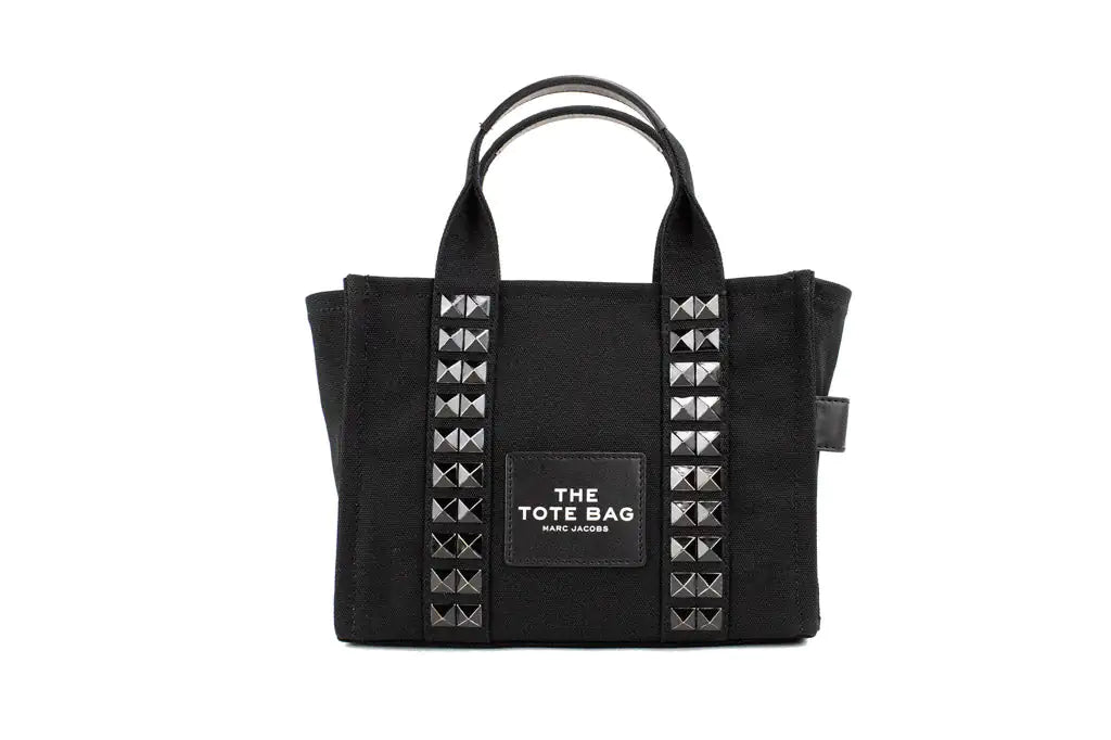 Marc Jacobs The Studded Mini Tote Black Cotton Canvas Crossbody HandbaMarc Jacobs The Studded Mini Tote – Black Cotton Canvas Crossbody HandbagMake a bold statement with Marc Jacobs The Studded Mini Tote in black cotton canvas. This stStudded Mini Tote Black Cotton Canvas Crossbody Handbag PurseStudded Mini Tote Black Cotton Canvas Crossbody Handbag Purse