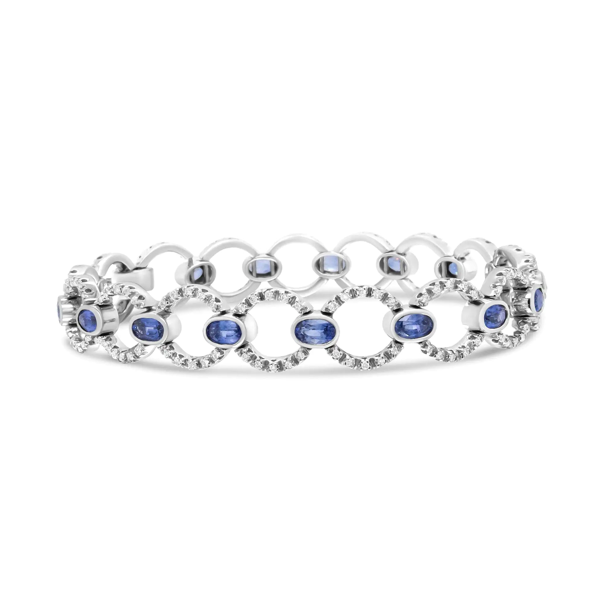 18K White Gold 6 Cttw Diamond and 5x3mm Oval Blue Sapphire Openwork CiThis luxury18k white gold link bracelet showcases a shimmering circle links set with glorious round white diamonds in prong settings. These sparkling stones total 6 5x3mm Oval Blue Sapphire Openwork Circle Link Bracelet 5x3mm Oval Blue Sapphire Openwork Circle Link Bracelet 