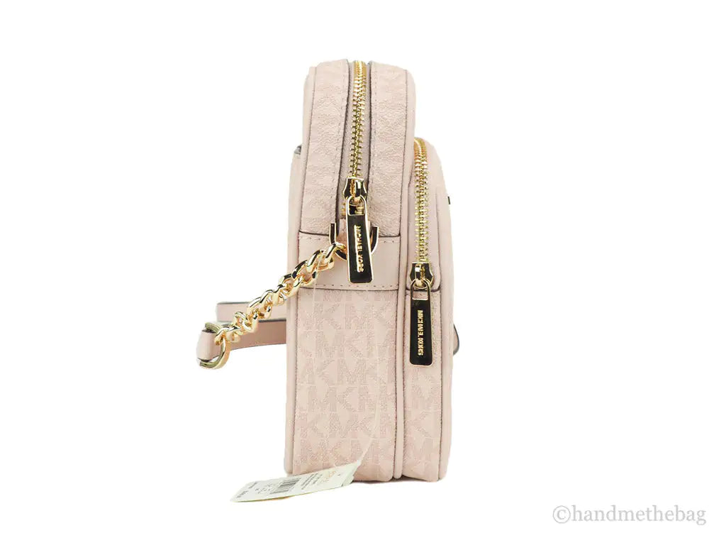 Michael Kors Jet Set Travel Medium Flight Crossbody Bag – Powder BlushTravel in style with the Michael Kors Jet Set Medium Flight Crossbody Bag in Powder Blush. Crafted from signature PVC, it features an inner slip pocket, 3 card slotsMichael Kors Jet Set Travel Medium Flight Crossbody Bag – Powder Blush PVCMichael Kors Jet Set Travel Medium Flight Crossbody Bag – Powder Blush PVC