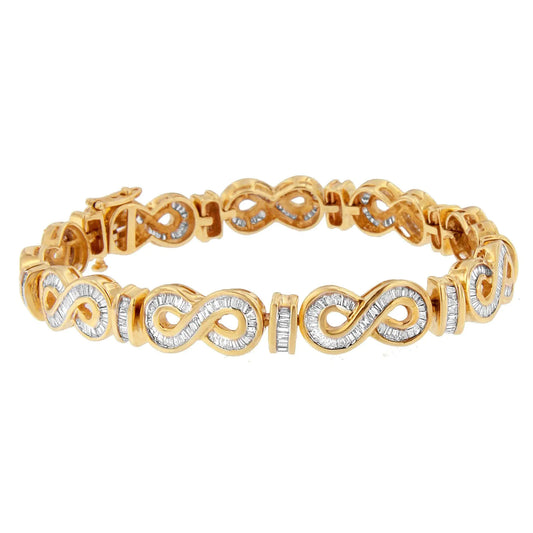 14K Yellow Gold Baguette Cut Diamond Bracelet (4.00 cttw, H-I Color, SShow her your eternal love with this stunning 14k yellow gold diamond infinity bracelet. Featuring elegant figure-eight designs adorned with dazzling baguette-cut di14K Yellow Gold Baguette Cut Diamond Bracelet 414K Yellow Gold Baguette Cut Diamond Bracelet 4