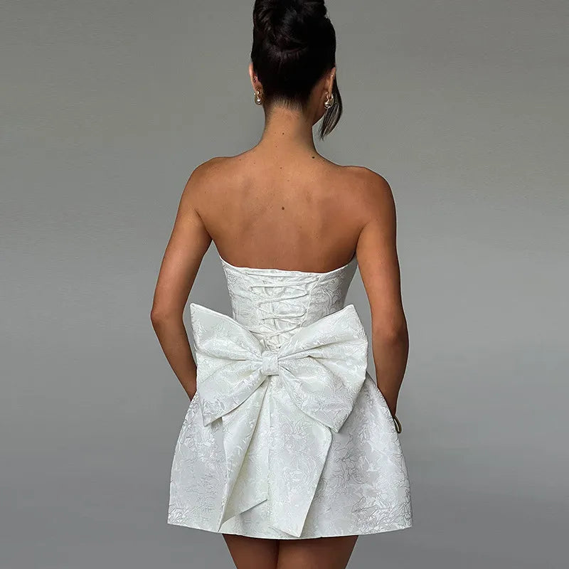 Chic White Tube Top Bow Dress – Elegant A-Line Silhouette for Modern WEffortless Elegance with the Tube Top Bow DressStep into style with this Chic White Tube Top Bow Dress, thoughtfully designed for women who adore a blend of eleganceChic White Tube Top Bow Dress – ElegantChic White Tube Top Bow Dress – Elegant