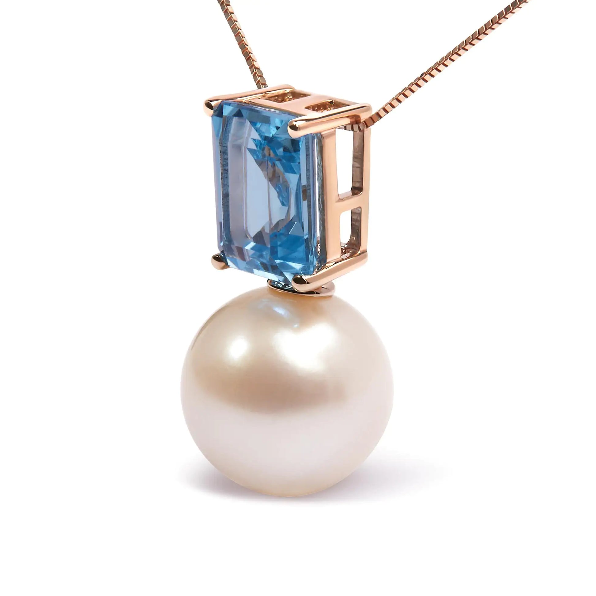 14K Rose Gold Pearl and Swiss Blue Topaz Pendant NecklaceThis exquisite 14K Rose Gold Pendant Necklace features a stunning combination of a lustrous pearl and Swiss blue topaz, totaling 3 1/3 carats. The elegant design is Swiss Blue Topaz Pendant NecklaceNecklacesSwiss Blue Topaz Pendant Necklace