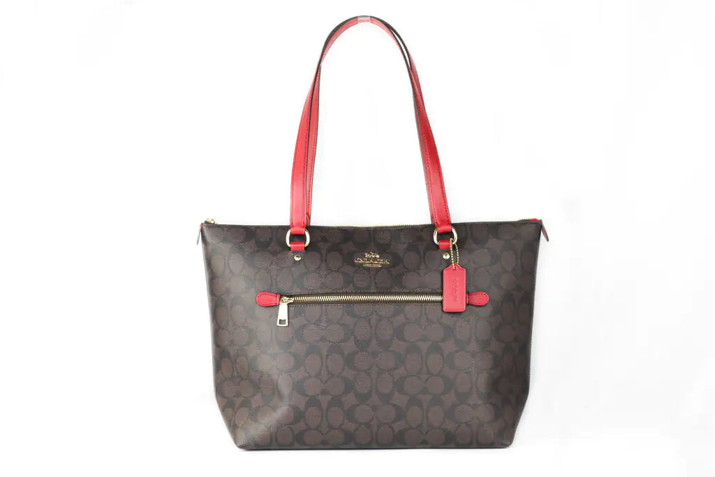 Coach (79609) Signature Canvas Brown Red Leather Gallery Tote Handbag Coach Gallery Tote Handbag – Signature Canvas Brown with Red Leather AccentsMake a bold statement with the Coach Gallery Tote Handbag in signature canvas brown with Coach 79609 Signature Canvas Brown Red Leather Gallery Tote Handbag PurseCoach 79609 Signature Canvas Brown Red Leather Gallery Tote Handbag Purse