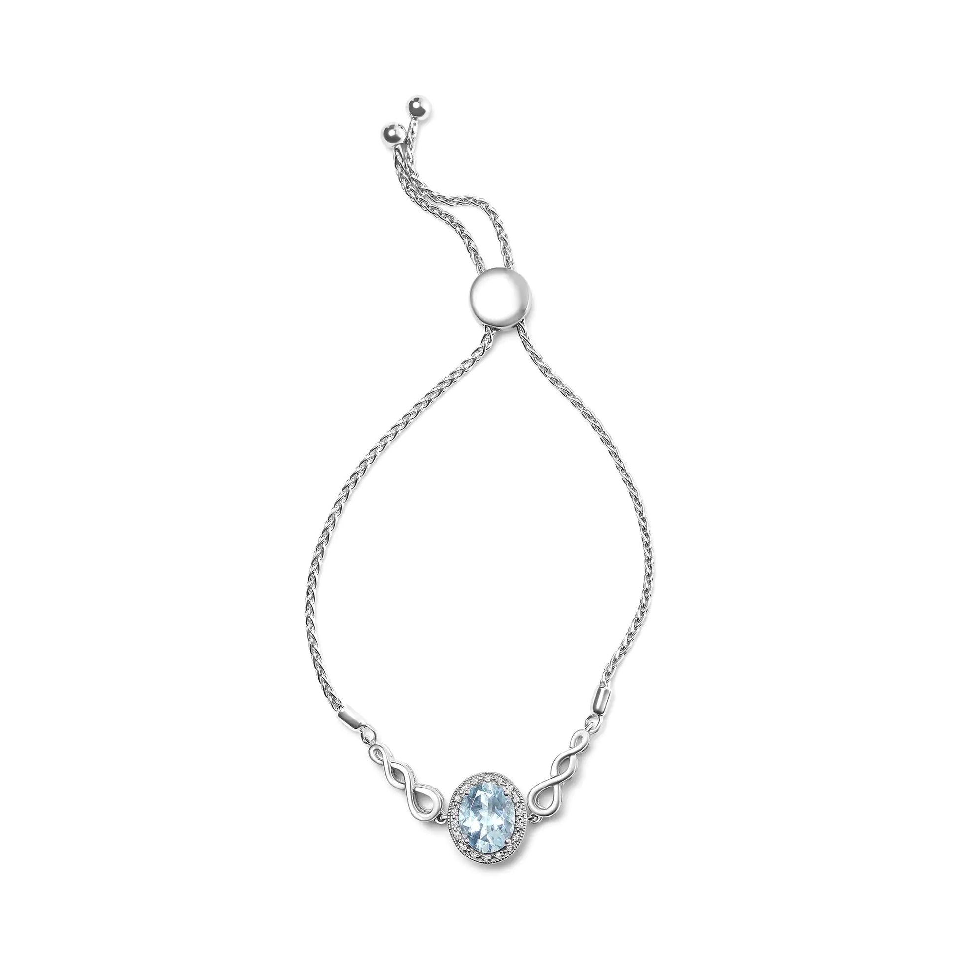 Sterling Silver Blue Topaz Lariat Bolo Bracelet with Diamond Accents –Be captivated by the exquisite beauty of this sterling silver lariat bolo bracelet, showcasing a breathtaking 10x8mm oval blue topaz as its dazzling centerpiece. TheSterling Silver Blue Topaz Lariat Bolo BraceletBraceletSterling Silver Blue Topaz Lariat Bolo Bracelet