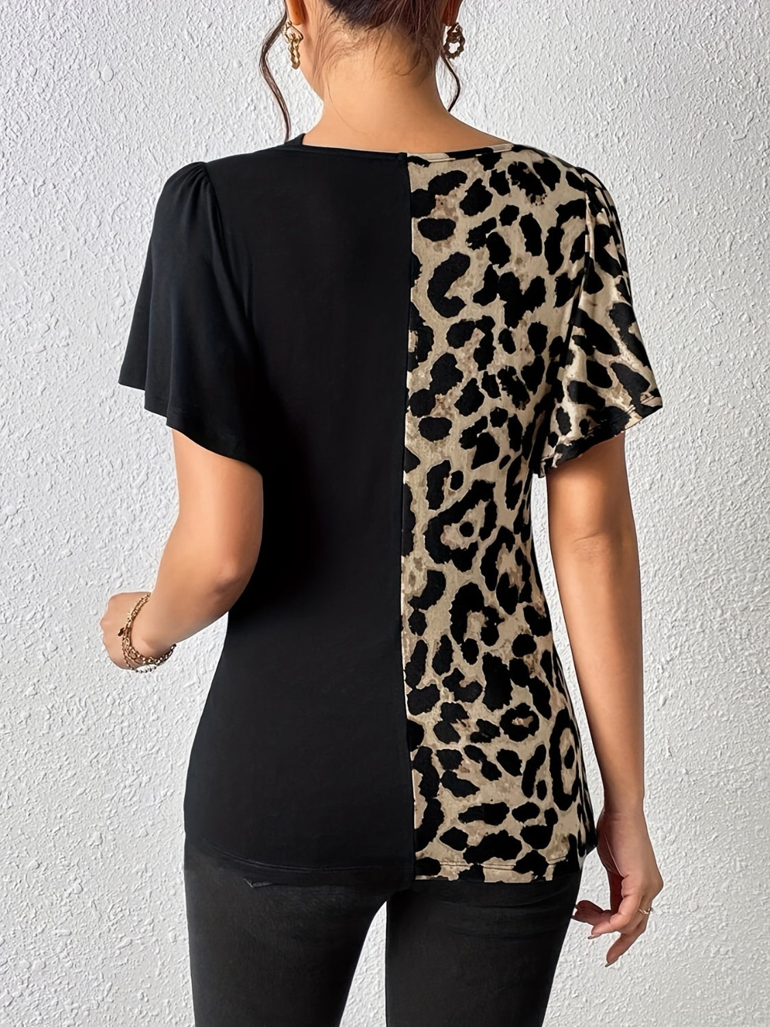 Ruched Leopard Flutter Sleeve T-ShirtIndulge in luxury with our Ruched Leopard Flutter Sleeve T-Shirt. The ruched detail and flutter sleeves add a touch of elegance to this already fierce leopard print Ruched Leopard Flutter SleeveRuched Leopard Flutter Sleeve