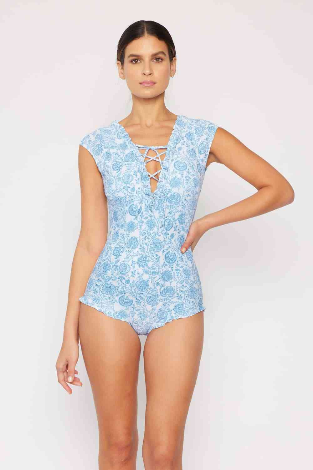 Marina West Swim Bring Me Flowers V-Neck One Piece Swimsuit In ThistleThis swimsuit is designed to make you feel like a true goddess of the sea, exuding style and sophistication with every step. The lace-up detail adds a touch of allurMarina West Swim BringMarina West Swim Bring