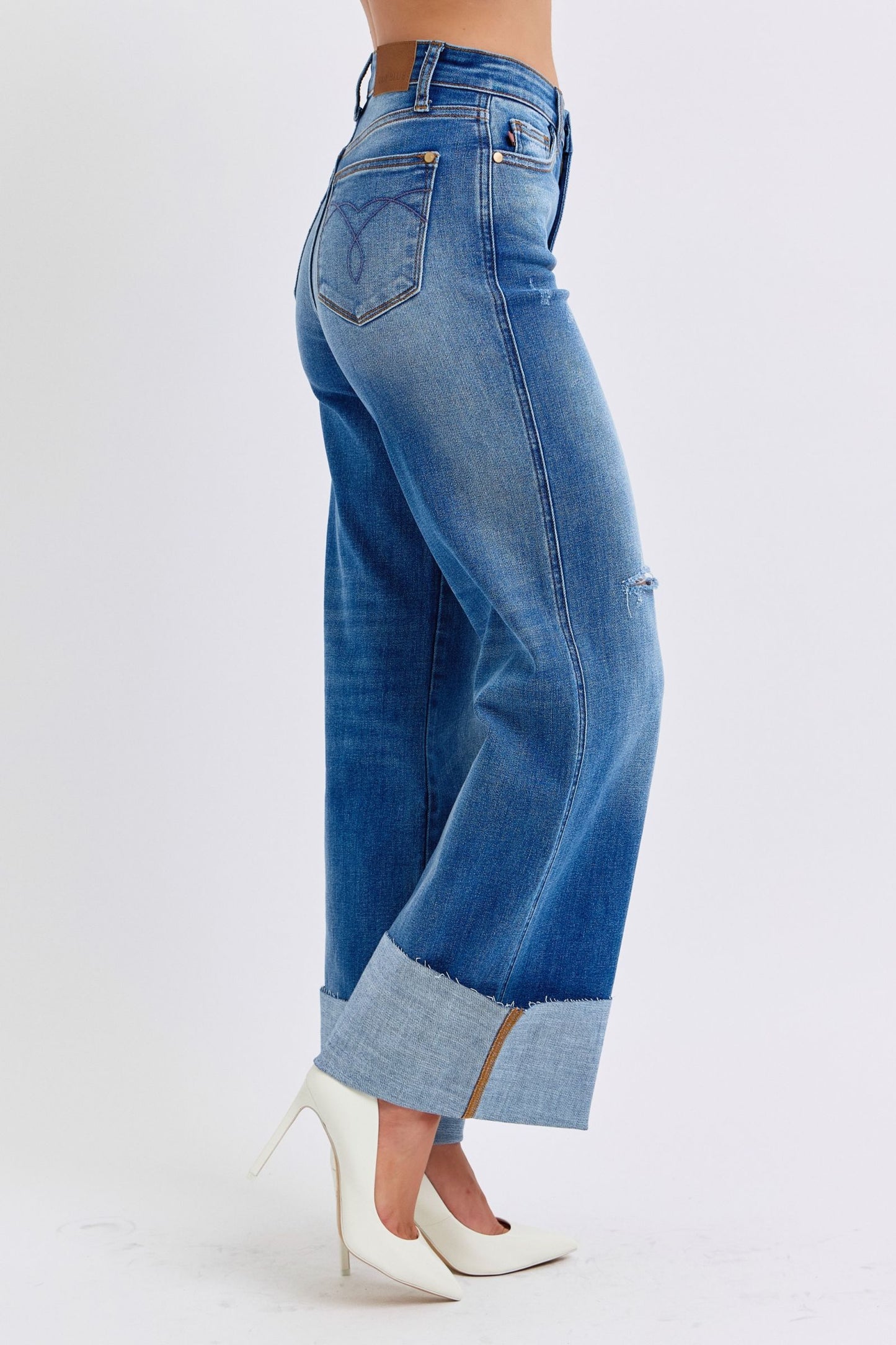 Judy Blue Full Size Distressed High Waist Wide Leg JeansThe Distressed High Waist Wide Leg Jeans are a stylish and on-trend choice for adding a touch of edge to your denim collection. The high waist design offers a flatteJudy Blue Full Size Distressed High Waist Wide Leg JeansJudy Blue Full Size Distressed High Waist Wide Leg Jeans