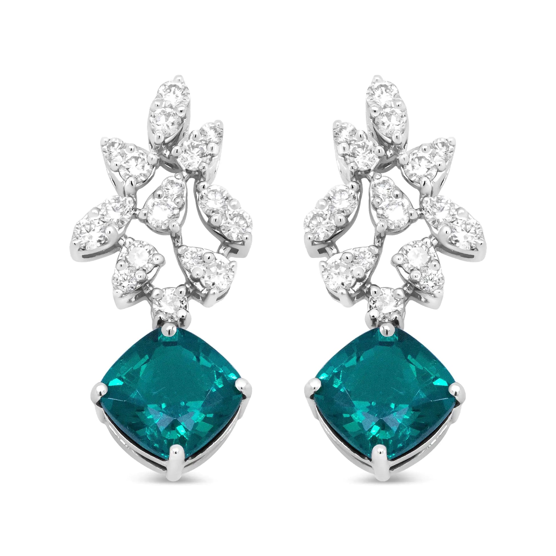 18K white gold diamond and emerald drop earrings with marquise silhouettes.