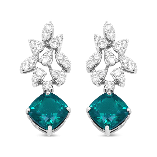 18K white gold diamond and emerald drop earrings with marquise silhouettes.