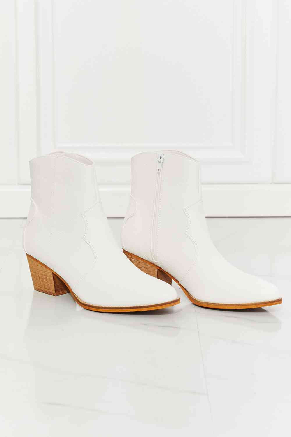 MMShoes Watertower Town Faux Leather Western Ankle Boots in WhiteThese Western-inspired booties feature a stacked heel and a faux leather upper. Their pointed toe adds a refined detail, making these a perfect choice to finish any chelsea boots womenchelsea boots women