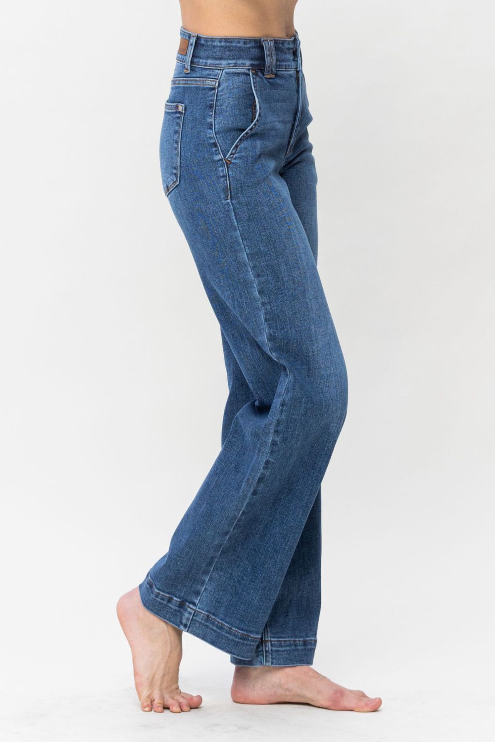 Judy Blue Full Size Double Button Wide Leg JeansHigh Rise Double button wide leg jeans are stylish wide leg jeans with a unique design and two buttons to add personality. Its loose pant leg cut, is comfortable andJudy Blue Full Size Double Button Wide Leg JeansJudy Blue Full Size Double Button Wide Leg Jeans