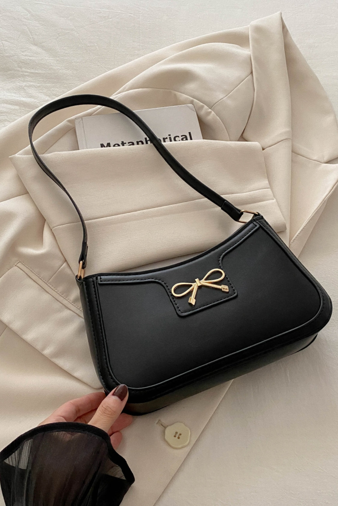 Bow Trim PU Leather Shoulder BagBow Trim PU Leather Shoulder Bag is a perfect blend of style and functionality. Crafted from high-quality elastomer and PU materials, this purse is designed to withsBow Trim PU Leather Shoulder BagBagBow Trim PU Leather Shoulder Bag