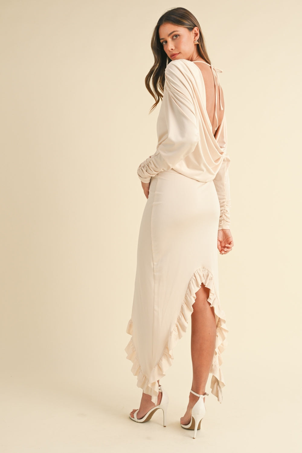 Mable Backless Asymmetric Ruffle Hem DressThe Backless Asymmetric Ruffle Hem Dress is a show-stopping piece that combines sexy and sophisticated elements. The solid stretchy fabric conforms to your body beauMable Backless Asymmetric Ruffle Hem DressMable Backless Asymmetric Ruffle Hem Dress